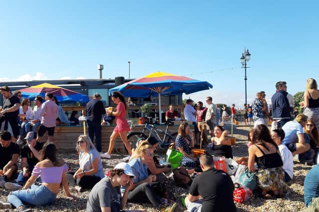 Large crowds gathered on the beach near Southsea Beach Cafe in Eastney Esplanade, Portsmouth.