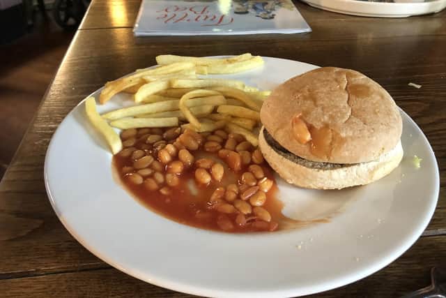 The children's burger, chips and beans