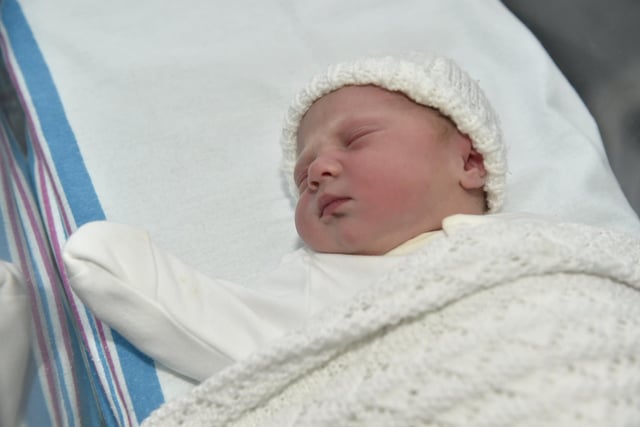 Eva Cooke born on Christmas Day at 7.38am weighing 6lb 14oz to parents Charlotte and Sam Cooke both 34 from Bournemouth. Eva was born via a surrogate from Havant. 

Picture: Sarah Standing