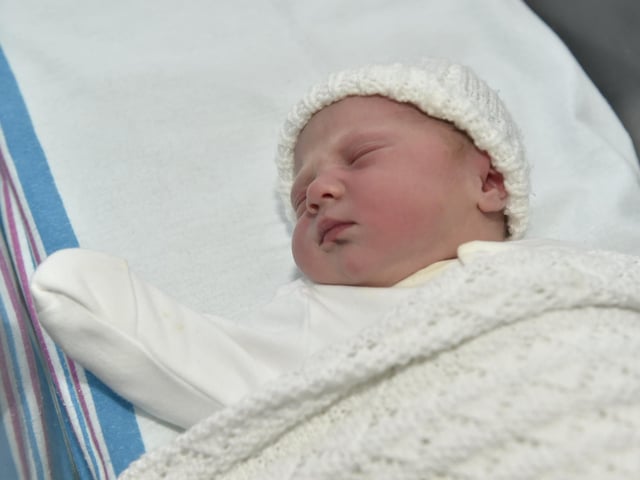 Eva Cooke born on Christmas Day at 7.38am weighing 6lb 14oz to parents Charlotte and Sam Cooke both 34 from Bournemouth. Eva was born via a surrogate from Havant. 

Picture: Sarah Standing