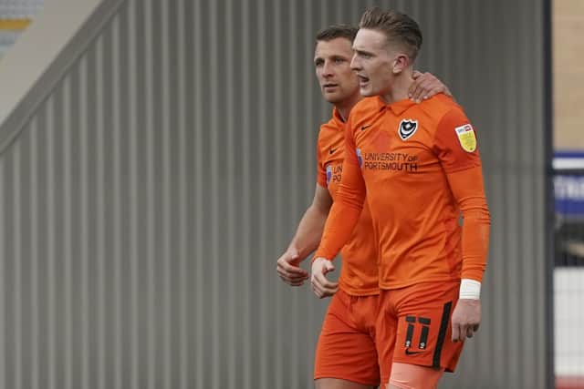 Ronan Curtis celebrates his goal against AFC Wimbledon with Lee Brown