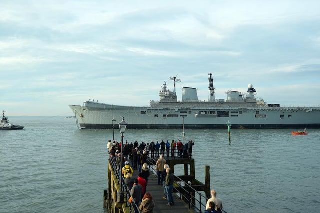 HMS Illustrious, a light aircraft carrier of the British Royal Navy, and affectionately known as 'Lusty', is towed out of Portsmouth Harbour in Portsmouth, southern England on December 7, 2016, on her last journey to Turkey where she has been sold for scrap.. Photo: Glyn Kirk/AFP via Getty Images