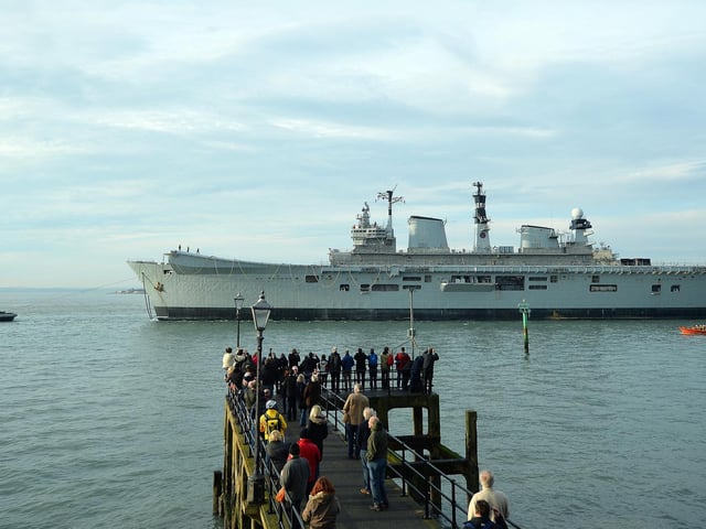 HMS Illustrious, a light aircraft carrier of the British Royal Navy, and affectionately known as 'Lusty', is towed out of Portsmouth Harbour in Portsmouth, southern England on December 7, 2016, on her last journey to Turkey where she has been sold for scrap.. Photo: Glyn Kirk/AFP via Getty Images