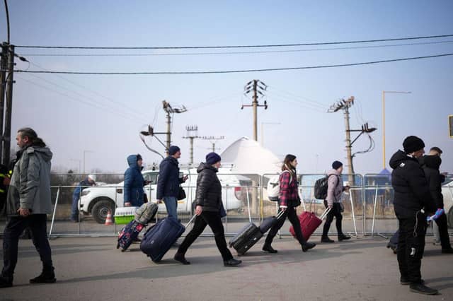 Ukrainian refugees cross the border crossing on March 04, 2022 in Vysne Nemecke, Slovakia. Photo by Christopher Furlong/Getty Images.