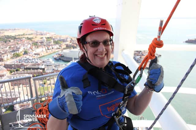 Caryl Purdy completing her abseil