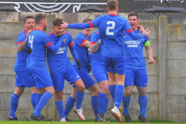 Fareham celebrate Garry Moody (right) having headed them into an early 2-0 lead at Horndean. Picture: Martyn White