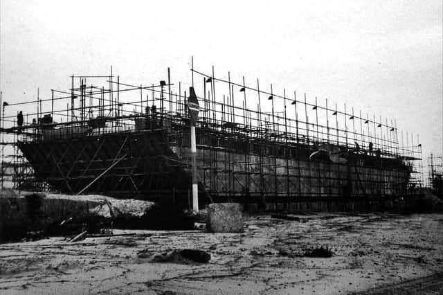 A Mulberry Harbour section under construction. One still remains in Langstone Harbour. Picture: Mike Beel collection.