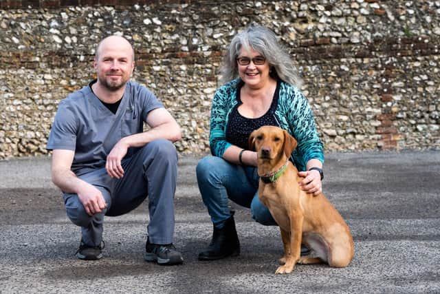 Nelly was on the verge of death, after being missing for ten days, but has since made an incredible recovery following amputation surgery. Nelly pictured with vet Tristan Shanks, L, and owner Jenny Holgate, R.
