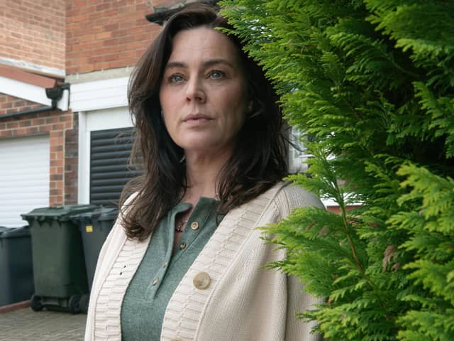 Emma (Jill Halfpenny) spends a lot of time lurking behind bushes in the new Channel 5 drama The Feud (Picture: Channel 5)