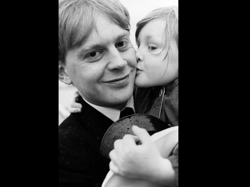 Alex Heron is welcomed on board HMS Newcastle by his daughter Amy (4) from Gosport, 1993. The News PP5015