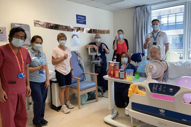 Kim Hills (on the bed) with QA Hospital staff. Picture: PHU