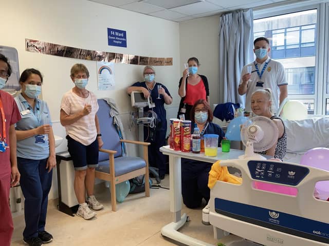 Kim Hills (on the bed) with QA Hospital staff. Picture: PHU
