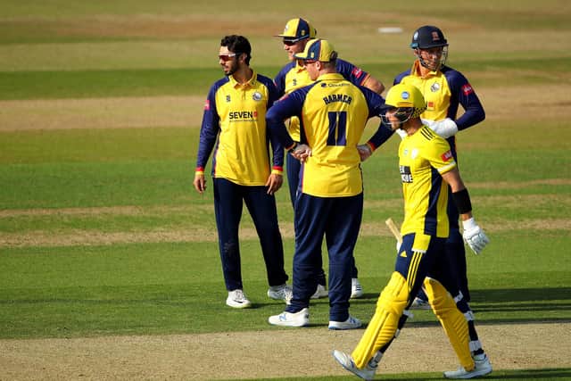 Aron Nijjar is congratulated after taking the wicket of Joe Weatherley. Photo by Warren Little/Getty Images.
