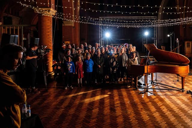 Shooting the video for St Lundi's Alone Over Christmas at Quay West Studios in Gosport with members of Hayling Youngstars and The Vox community choirs. Picture by Will Kenney