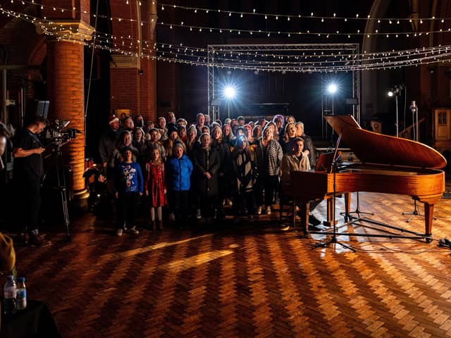 Shooting the video for St Lundi's Alone Over Christmas at Quay West Studios in Gosport with members of Hayling Youngstars and The Vox community choirs. Picture by Will Kenney