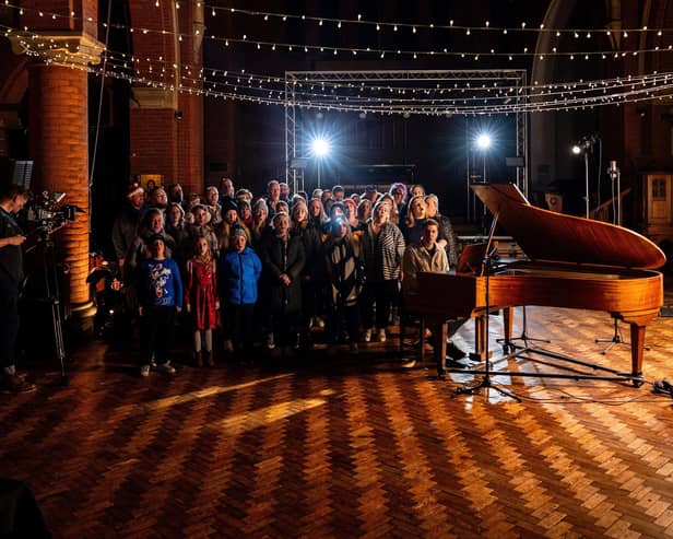 Shooting the video for St Lundi's Alone Over Christmas at Quay West Studios in Gosport with members of Hayling Youngstars and The Vox community choirs. Picture by Will Kenney