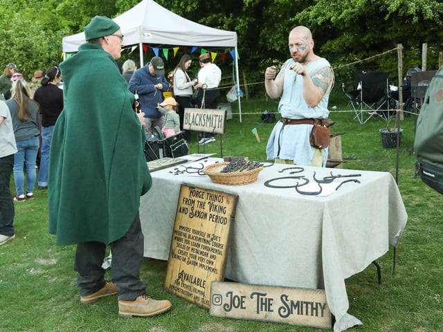 A blacksmith demonstrates ancient techniques at Beltain Festival.