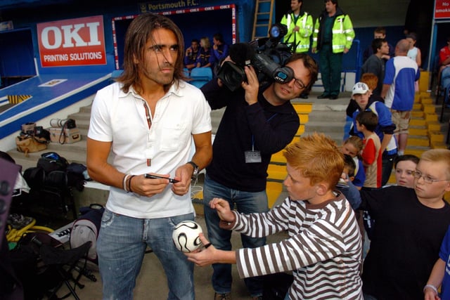 Pedro Mendes signs authograph for these young Pompey fans in the Blues dugout at Fratton Park in 2006