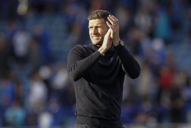 Pompey head coach John Mousinho applauds the Fratton faithful at the final whistle