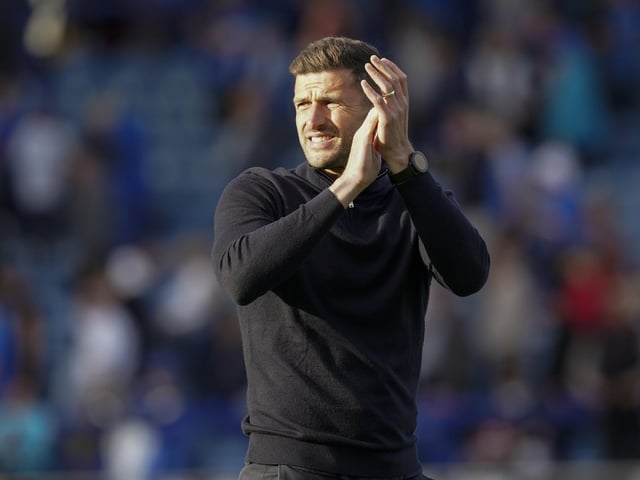 Pompey head coach John Mousinho applauds the Fratton faithful at the final whistle
