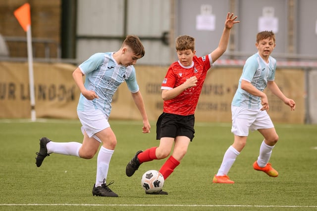 Action from the Portsmouth Youth League Geldard Invitation Cup final between Jubilee 77 U13s and Castle United U13s (light blue and white kit). Picture: Keith Woodland (190321-387)