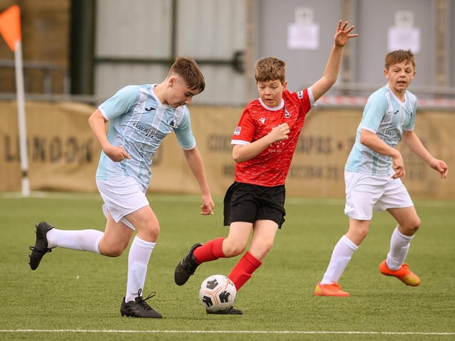 Action from the Portsmouth Youth League Geldard Invitation Cup final between Jubilee 77 U13s and Castle United U13s (light blue and white kit). Picture: Keith Woodland (190321-387)
