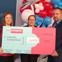The cheque presentation at the opening of the Havant Home Bargains store