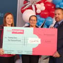 The cheque presentation at the opening of the Havant Home Bargains store