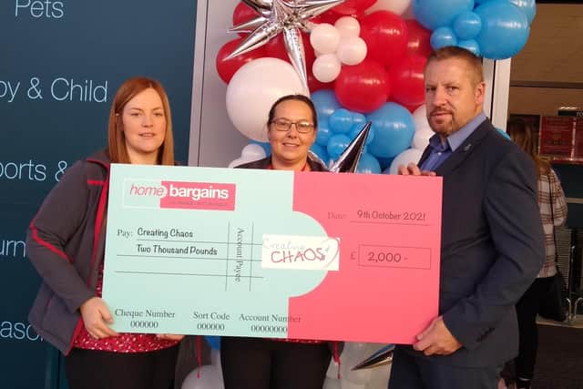The cheque presentation at the opening of the Havant Home Bargains store