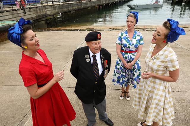 Veteran Jack Quinn is serenaded by The Charlalas. D-Day veterans come ashore in a landing craft at Portsmouth HIstoric Dockyard to mark the 77th anniversary of the decisive wartime event
Picture: Chris Moorhouse (jpns 060621-13)