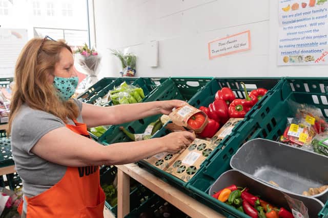 Volunteer Vicky Thompson with some of the produce on sale.
Picture: Keith Woodland (200621-6)
