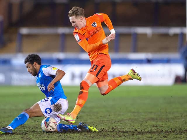 Ronan Curtis battles with Nathan Thompson during the 1-0 defeat at Peterborough - with Joe Gallen praising the Pompey commitment. Picture: Nigel Keene/ProSportsImages