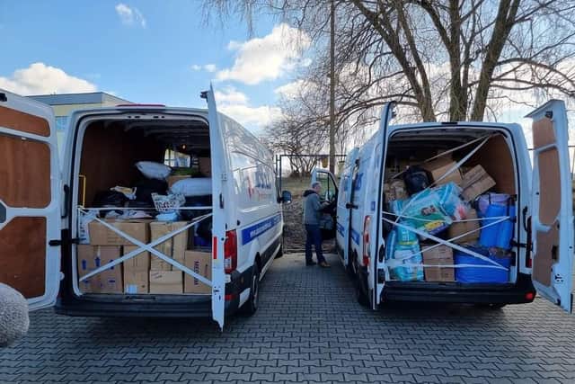 The two vans filled with donations.