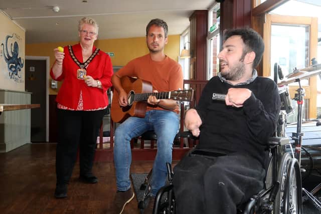 From left, Mayor Cllr Rosie Raines, (red) with Tim Brownsea and Shaun Shears, performers at the event.
Picture: Sam Stephenson