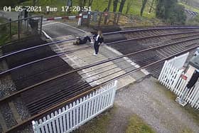 Girl pictured lying down on railway tracks near Horsham. Picture: Network Rail