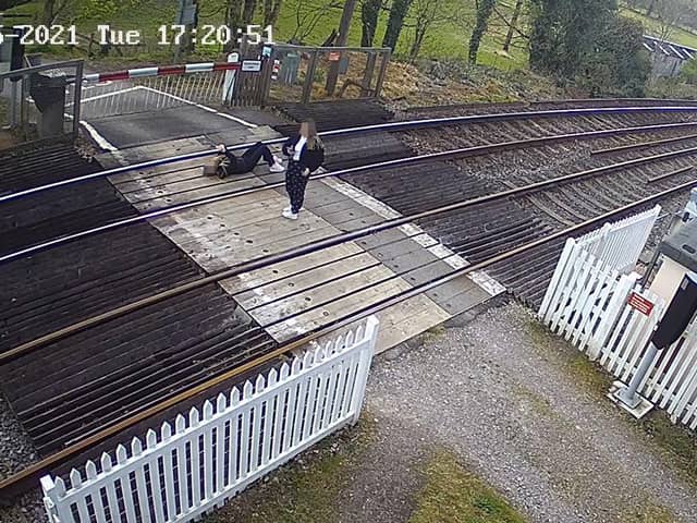 Girl pictured lying down on railway tracks near Horsham. Picture: Network Rail