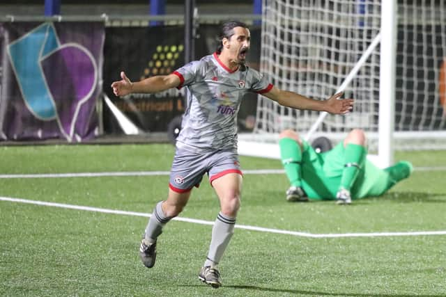 Gosham striker Dean Clarke celebrates his second goal. Picture by Dave Haines