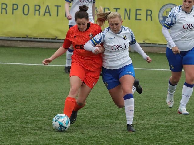 Hawks' Jodie Burchell battles it out with Gosport Falcons' Charlie Scott. Picture: Dave Haines