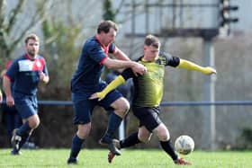 Jamie White, pictured (right) in Hampshire Premier League action for Infinity, belted 51 Wessex League Premier goals for Winchester City in 2011/12.
Picture: Chris Moorhouse