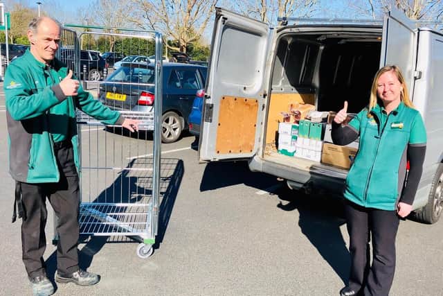 Paul Blythe from Morrisons Gosport with Charlotte Tillett, the store’s head of food bank operations, loading up the Gosport Borough FC kit van. Picture by Keith Slater