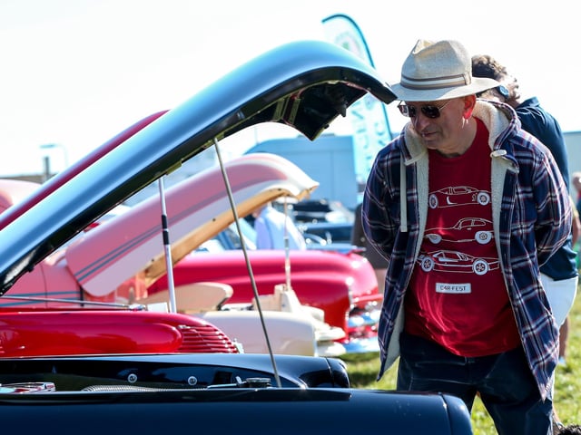 Gerald Barnes admires a 1952 Ford.