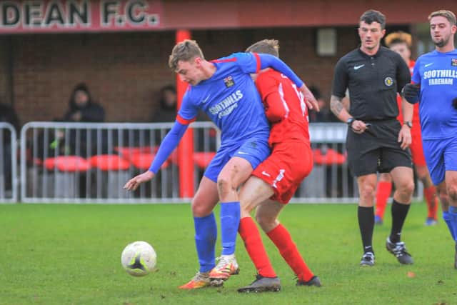 Fareham's Archie Wilcox battles for possession at Horndean. Picture: Martyn White