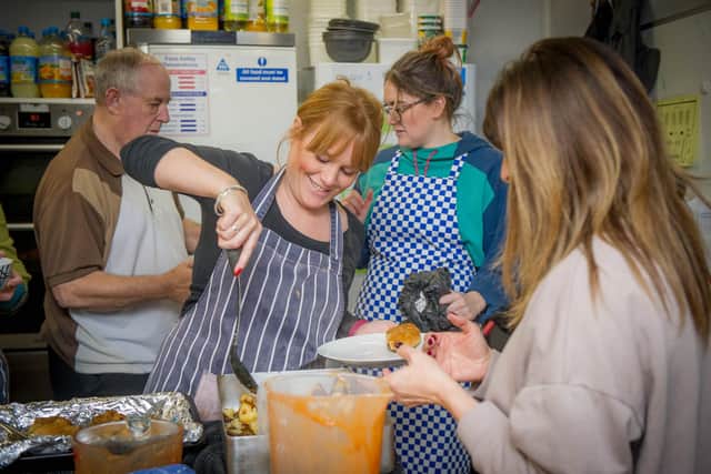 Staff prepare and dish out food on a busy night at the Life house. Picture: Habibur Rahman