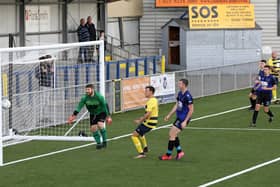 Grove captain Aaron Fennemore, far right, scores his second goal from an acute angle against Clanfield. Picture: Chris Moorhouse