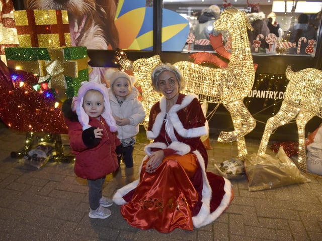Lee-on-the-Solent Christmas lights were switched on in the High Street on Friday, November 24.Pictured is: (l-r) Phoenix-Storm Vasilli (3) from Gosport and Darcie Brown (2) from Stubbington with Mrs Claus.Picture: Sarah Standing (241123-2255)