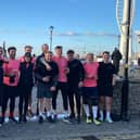 The team of 13 celebrate the end of their 48 running challenge.
Credit: George Hill
