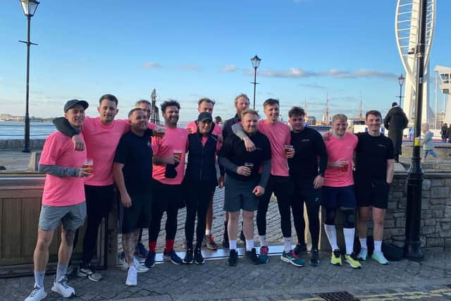The team of 13 celebrate the end of their 48 running challenge.
Credit: George Hill