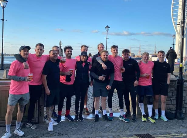 The team of 13 celebrate the end of their 48 running challenge.
Credit: George Hill