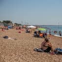 People enjoying some fine weather on Southsea Beach.