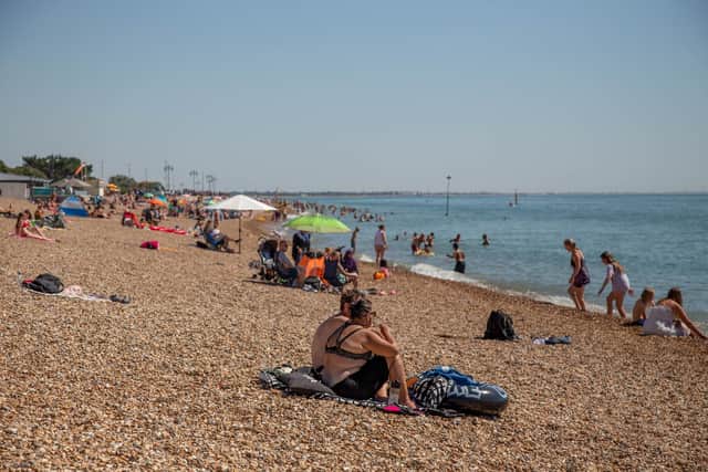 People enjoying some fine weather on Southsea Beach.
